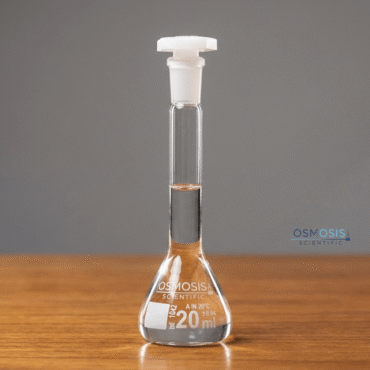 Clear glass trapezoidal volumetric flask for precise laboratory measurements