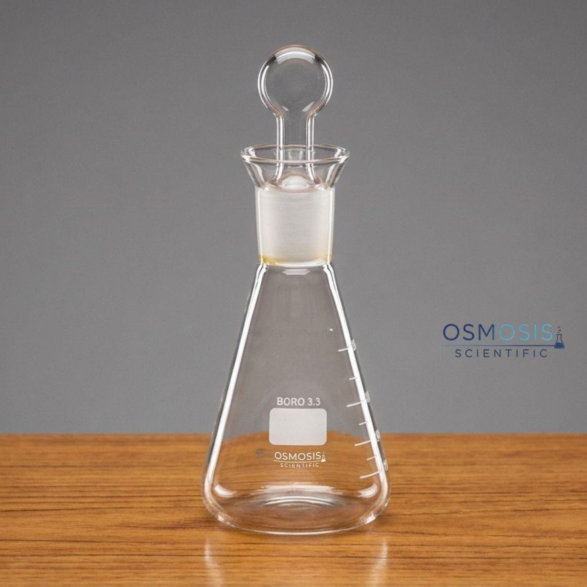 A 250ml clear borosilicate glass iodine flask featuring a conical body, a wide neck with a ground glass stopper, and white graduation markings.