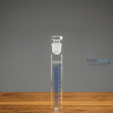 A 100ml clear borosilicate glass graduated test tube with a ground glass joint and hexagonal stopper, featuring blue measurement markings.